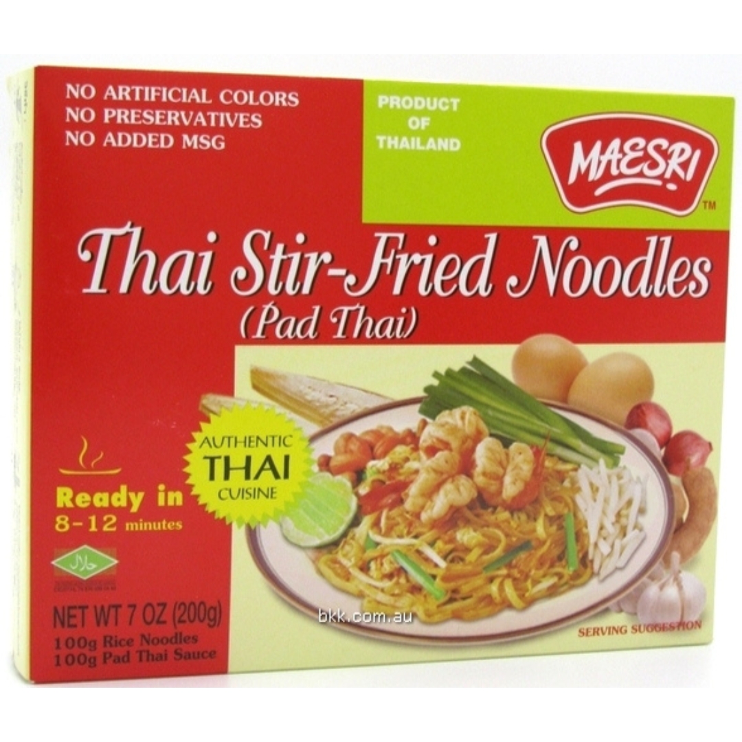 a box of Maesri Thai Stir Fried Rice Noodles. The box is red, yellow and light green. It features text in Thai and English, including the Maesri logo, product name "Thai Stir-Fried Noodles (Pad Thai)," and "Authentic Thai Cuisine." The box also shows an image of a plate of Pad Thai with shrimp, egg, peanuts, and bean sprouts.