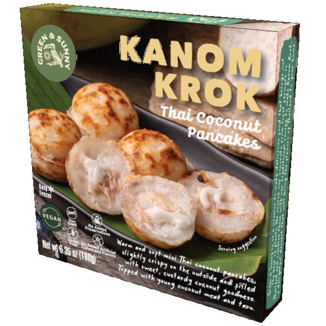 A box of Green&Sunny Kanom Krok Thai Coconut Pancakes sitting on top of a plate.